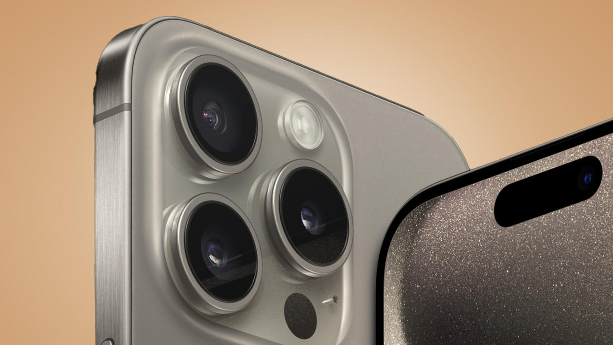  The iPhone 15 Pro series cameras on a beige background. 
