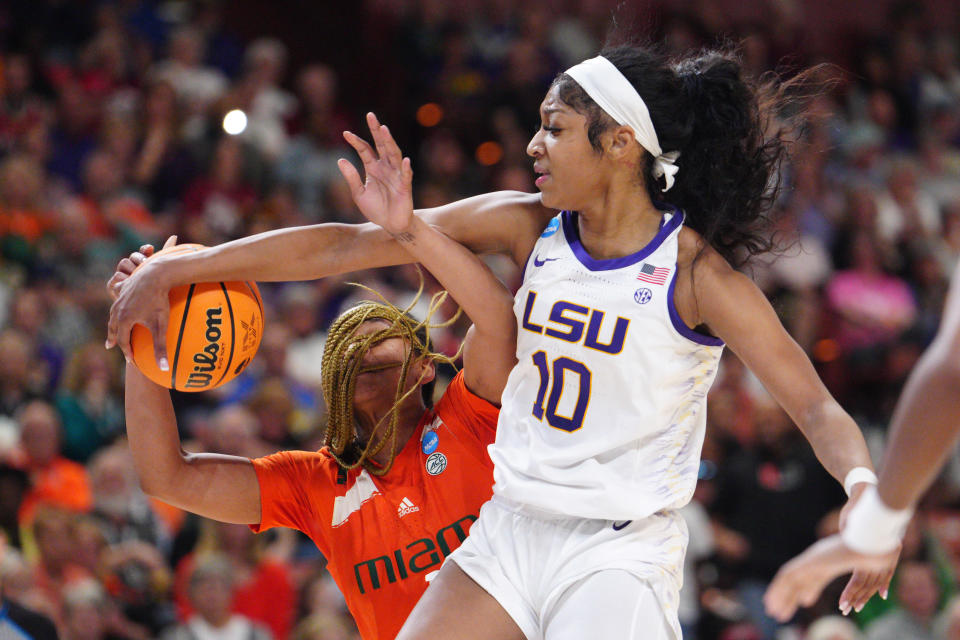 LSU's Angel Reese blocks a shot from Miami's Jasmyne Roberts during the Elite Eight round of the NCAA women's tournament at Bon Secours Wellness Arena in Greenville, South Carolina, on March 26, 2023. (Jacob Kupferman/NCAA Photos via Getty Images)