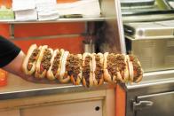 <p><strong>Hot Wiener</strong></p><p>A creation of the <a href="https://www.olneyvillenewyorksystem.com/" rel="nofollow noopener" target="_blank" data-ylk="slk:Olneyville New York System Restaurant;elm:context_link;itc:0;sec:content-canvas" class="link ">Olneyville New York System Restaurant</a> in Providence, Rhode Island, the Hot Wiener includes veal and pork in a steamed bun, topped with mustard, chopped onion, celery salt and a secret sauce with ground beef. </p>