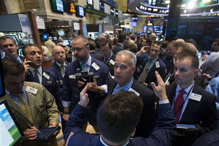 Traders work on the floor of the New York Stock Exchange May 21, 2014. REUTERS/Brendan McDermid