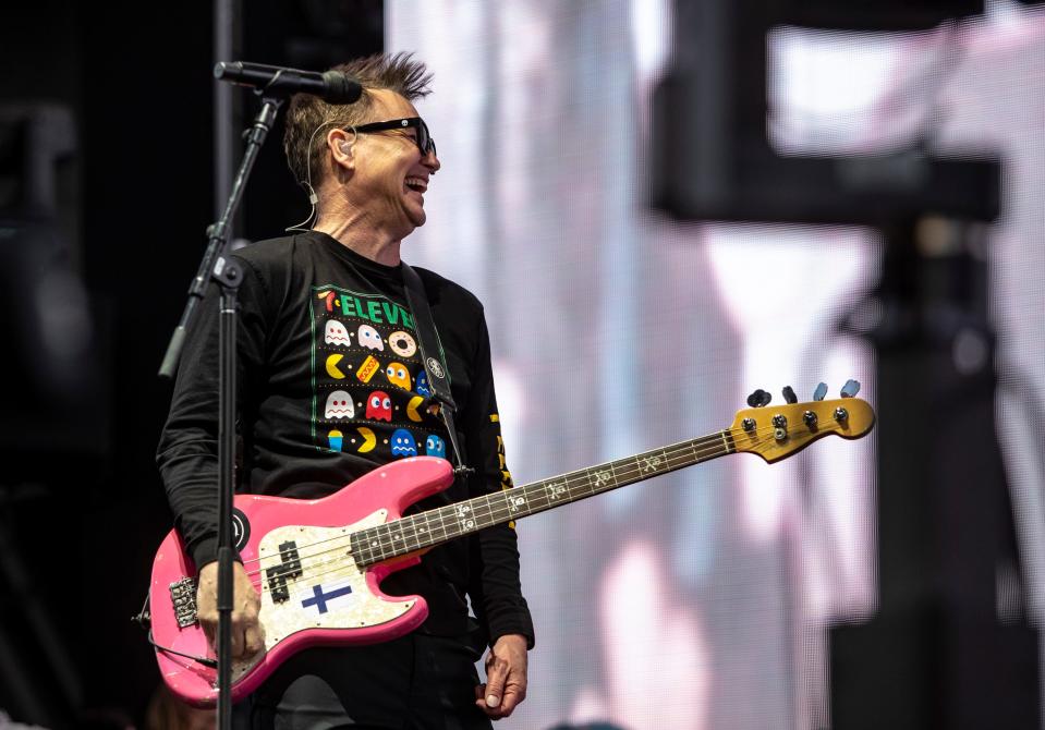 Blink-182 bassist and vocalist Mark Hoppus smiles to bandmates during their set in the Sahara tent during the Coachella Valley Music and Arts Festival at the Empire Polo Club in Indio, Calif., Friday, April 14, 2023. 