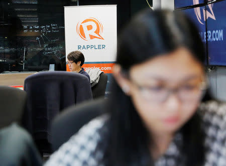Journalists work at the office of Rappler in Pasig, Metro Manila, Philippines January 15, 2018. REUTERS/Dondi Tawatao