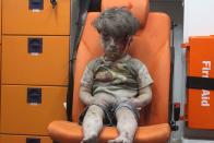 <p>Omran Daqneesh, 5, of Syria sits alone in the back of the ambulance after he was injured during an air strike targeting the Qaterji neighborhood of Aleppo.</p>