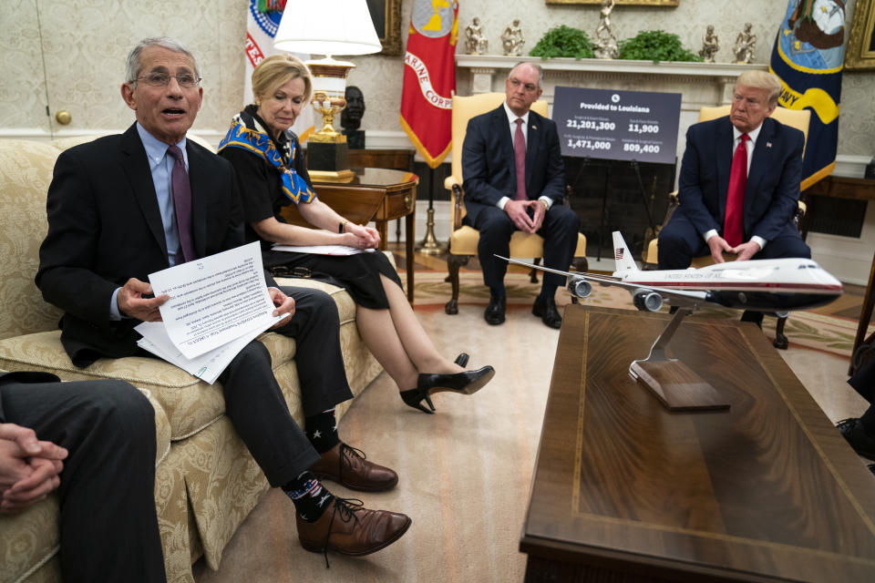 FILE - In this April 29, 2020, file photo Director of the National Institute of Allergy and Infectious Diseases Dr. Anthony Fauci speaks during a meeting between President Donald Trump and Gov. John Bel Edwards, D-La., about the coronavirus response, in the Oval Office of the White House in Washington. From left, Fauci, White House coronavirus response coordinator Dr. Deborah Birx, Bel Edwards, and Trump. (AP Photo/Evan Vucci)