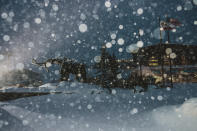 In this photo provided by the Mammoth Mountain Ski Area, fresh snow surrounds the Mammoth Mountain ski resort in Mammoth Lakes, Calif., on Monday, Dec. 13, 2021. Forecasters say the state's highest peaks could get as much as 8 feet of snow while lower elevations across California are in for a serious drenching of rain. The storm is expected to last days before moving out, but another storm is on the way. Forecasters warned people in mountainous areas to prepare for days of snowfall and possible road closures. (Peter Morning/Mammoth Mountain Ski Area via AP)