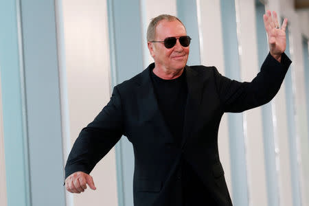 Designer Michael Kors waves after the showing of his Spring/Summer 2019 collection during New York Fashion Week in New York, U.S., September 12, 2018. REUTERS/Shannon Stapleton/File Photo