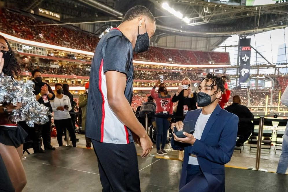 Dominic Williams proposes to Atlanta Falcons cheerleader Benjamin Ajani. (Karl L. Moore / Atlanta Falcons)