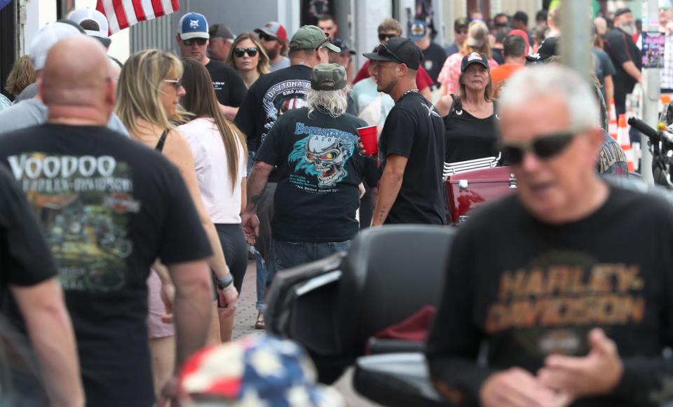 Crowds pack the sidewalk along Main Street, checking out the shops and bikes on the opening day of the 83rd annual Bike Week. The 10-day event runs through March 10 in Daytona Beach and throughout Central Florida.