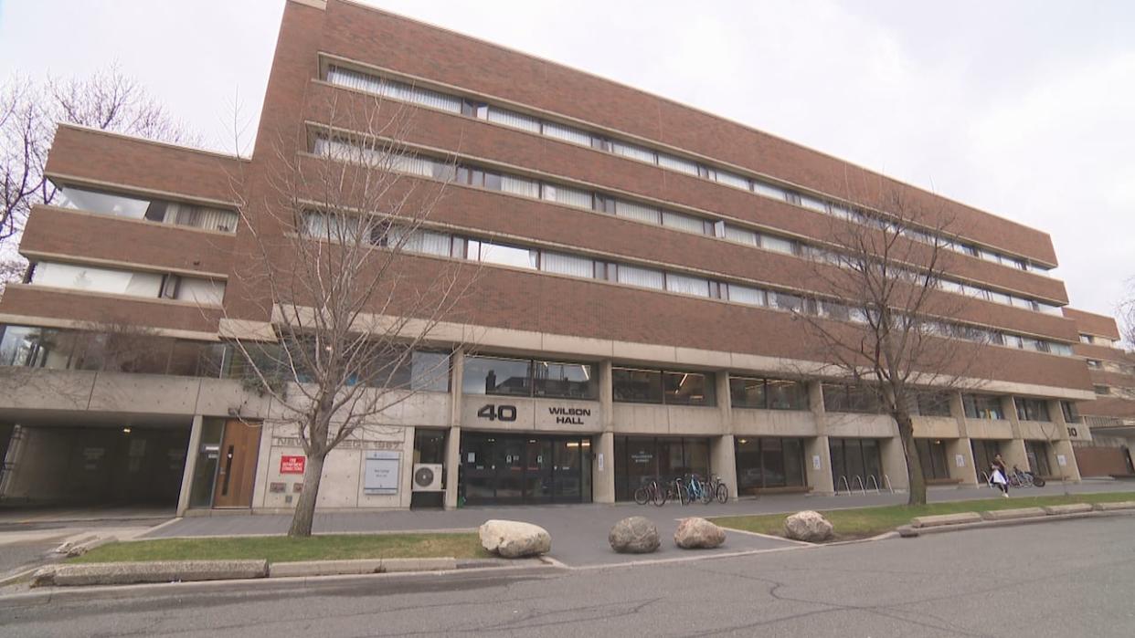 A man, 19, has been charged with voyeurism and mischief after a female student reported that a cellphone was held over a shower curtain and recording while she was taking a shower at the University of Toronto's Wilson Hall Residence at New College.  (CBC - image credit)