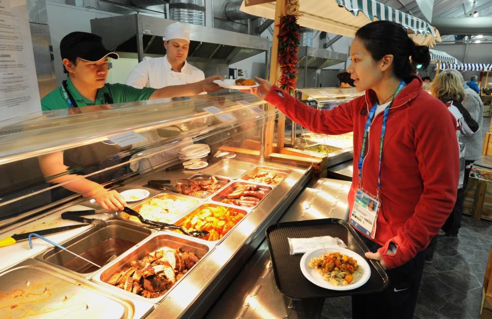 Only one piece of handheld food can be taken from the Olympic Village food court.