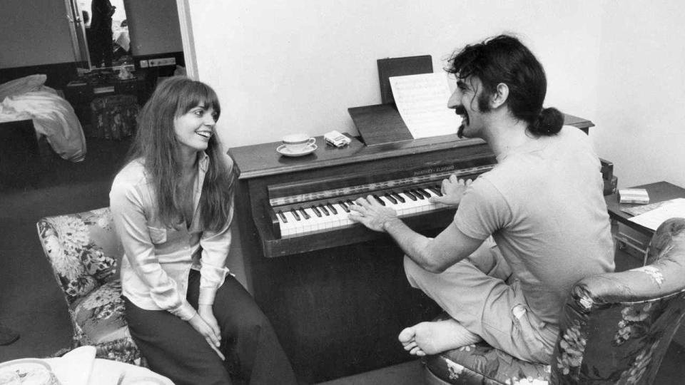 Frank Zappa at a piano with his wife Gail
