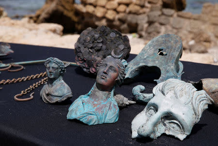 Items, which the Israel Antiquities Authority (IAA) estimate to be around 1600 years old, are displayed after it was recovered from a merchant ship in the ancient harbor of the Caesarea National Park May 16, 2016. REUTERS/ Baz Ratner