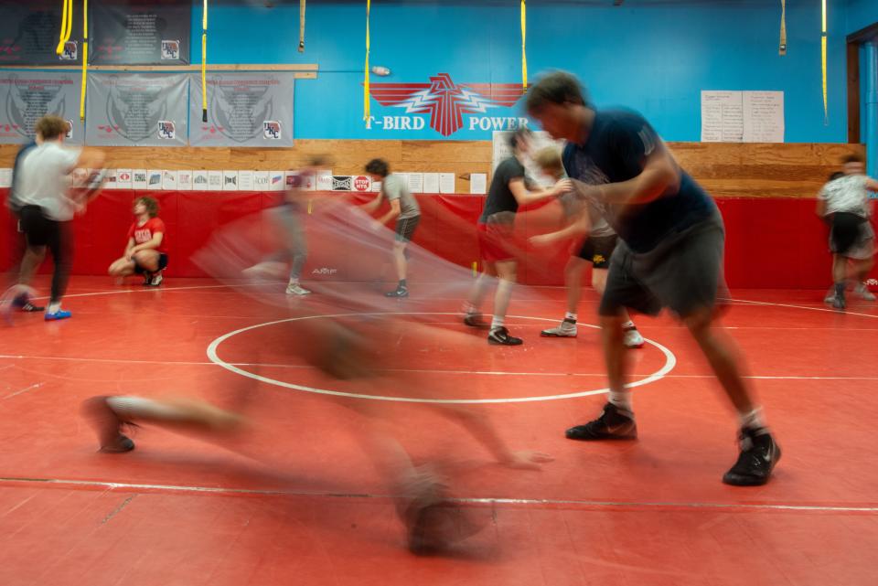 Quick 30-second matches are intermixed with technique learning and drills Wednesday morning as the Shawnee Heights boys wrestling team takes to the mats in their workout room.