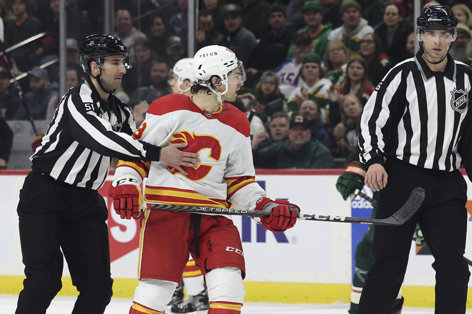 Calgary Flames left wing Andrew Mangiapane (88) reacts after receiving a minor penalty during the second period of the team's NHL hockey game against the Minnesota Wild, Tuesday, March 7, 2023, in St. Paul, Minn. (AP Photo/Stacy Bengs)