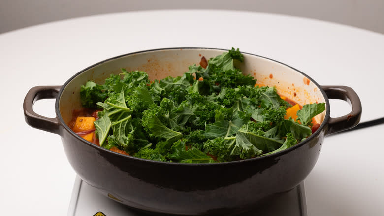 pan with casserole and kale