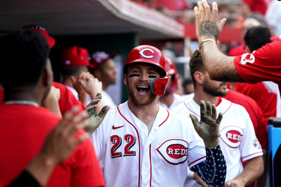 Cincinnati Reds third baseman Brandon Drury (22) is congratulated in the dugout after hitting a three-run home run during the third inning of a baseball game against the New York Mets, Monday, July 4, 2022, at Great American Ball Park in Cincinnati.