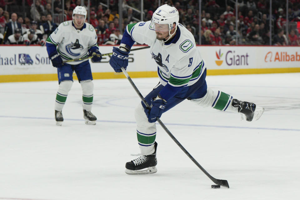 Vancouver Canucks center J.T. Miller (9) scores a goal against the Washington Capitals during the second period of an NHL hockey game, Monday, Oct. 17, 2022, in Washington. (AP Photo/Jess Rapfogel)