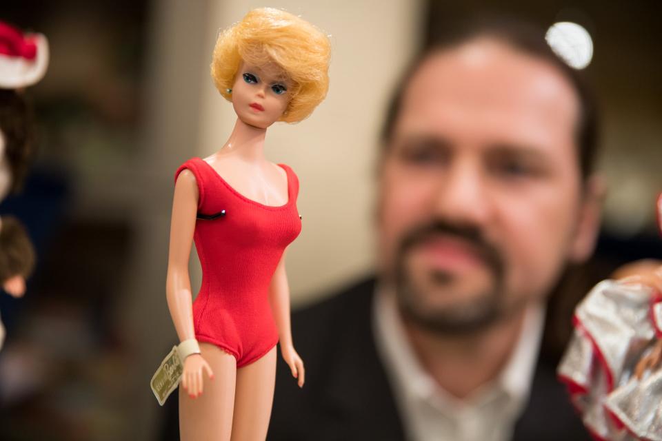 A Barbie doll from 1962 is examined in 2017.