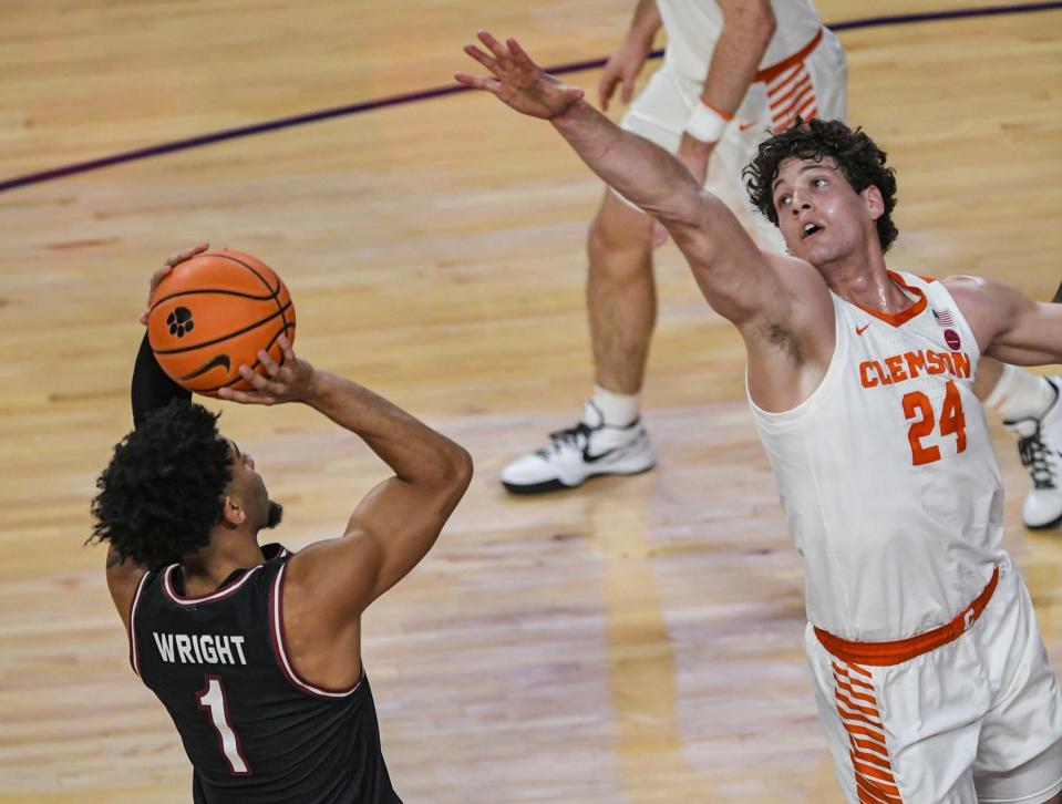 Dec 6, 2023; Clemson, South Carolina, USA; University of South Carolina guard Jacobi Wright (1) shoots the ball near Clemson junior forward PJ Hall (24) during the first half at Littlejohn Coliseum. Ken Ruinard-USA TODAY Sports