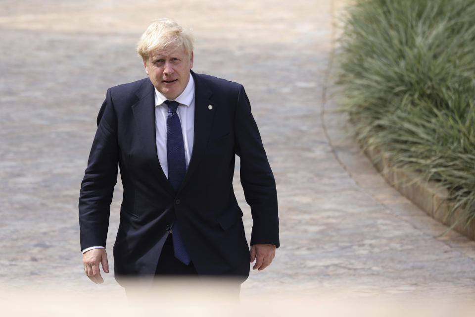 Britain's Prime Minister Boris Johnson arrives for the Leaders' Retreat on the sidelines of the Commonwealth Heads of Government Meeting at Intare Conference Arena in Kigali, Rwanda, Saturday, June 25, 2022. (Dan Kitwood/Pool Photo via AP)