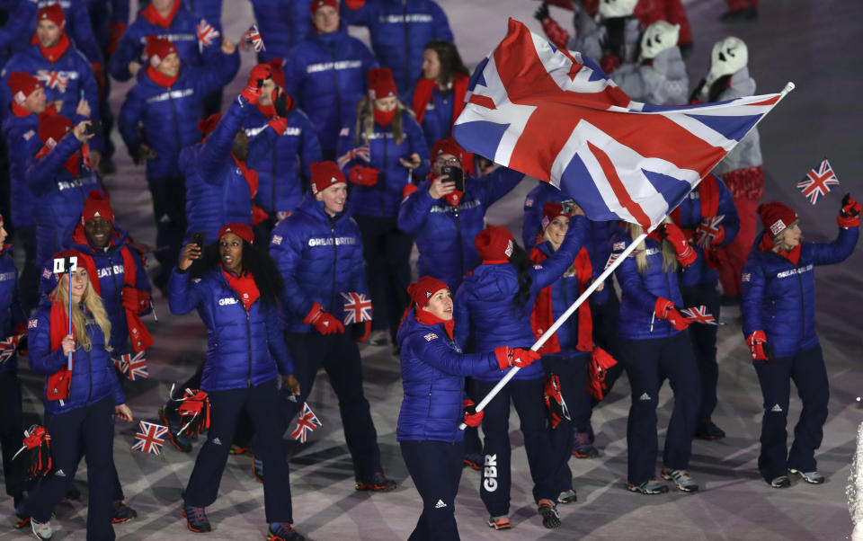 <p>Lizzy Yarnold carries the flag of Britain during the opening ceremony of the 2018 Winter Olympics in Pyeongchang, South Korea, Friday, Feb. 9, 2018. (AP Photo/Michael Sohn) </p>