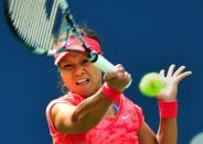 Li Na of China returns a shot to Sofia Arvidsson of Sweden during their 2013 US Open women's singles match at the USTA Billie Jean King National Tennis Center August 28, 2013 in New York. Li advanced to the third round of the US Open on Wednesday by defeating 100th-ranked Arvidsson 6-2, 6-2