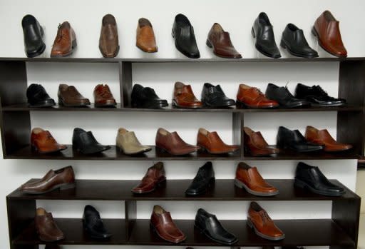 View of men shoes made with a hidden insole, to increase height, in a store in Mexico City on January 16, 2013. AFP PHOTO/ OMAR TORRES (AFP | omar torres)