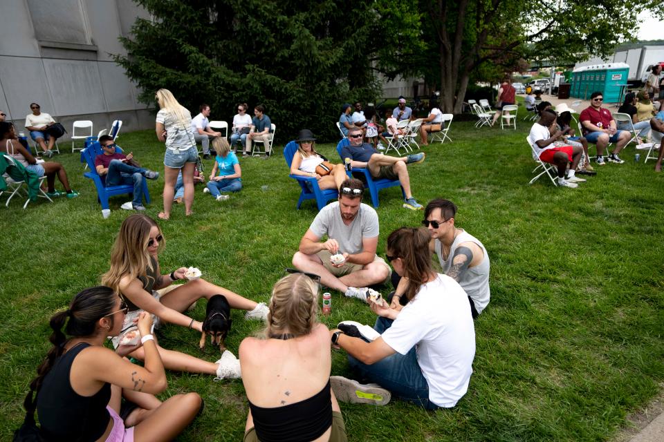 People eat at Taste of Cincinnati 2023. The food festival takes place Memorial Day weekend.