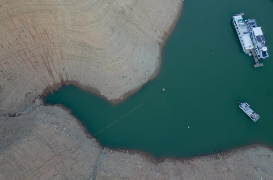 <div class="inline-image__caption"><p>Grounds marked with previous water levels at Oroville Lake in Oroville, California, U.S., on Tuesday, June 22, 2021. Kyle Grillot/Bloomberg via Getty Images"</p></div> <div class="inline-image__credit">Bloomberg</div>