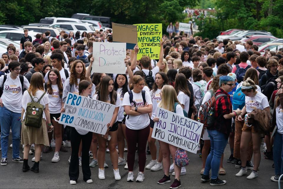 Students at Turpin High School in Anderson Township walk out of school during class to defend Diversity Day, which was canceled this year. Administrators postponed the event on short notice due to parent and board concerns and rescheduled the event for mid-May. The school board then banned the event from occurring on school property or with school funds.