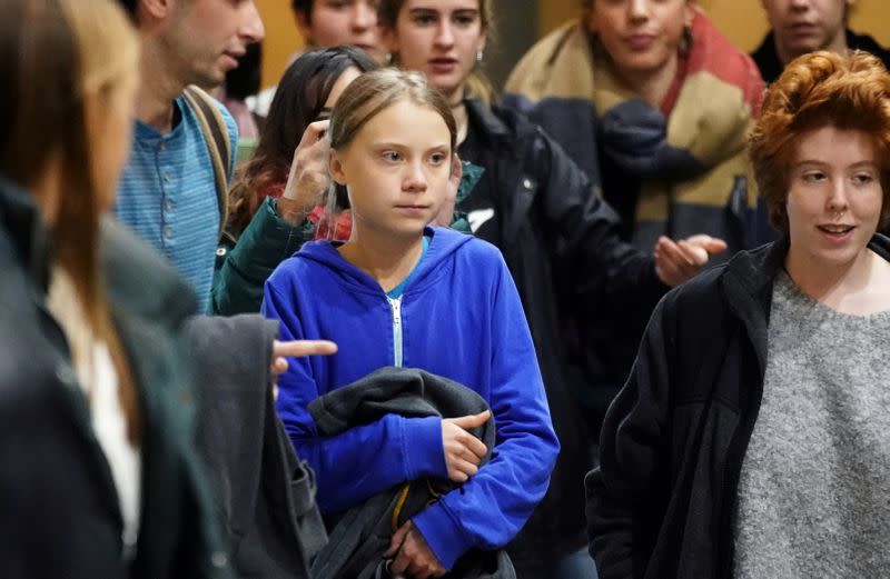 FILE PHOTO: Climate change activist Greta Thunberg leaves after a meeting at Complutense University, as COP25 climate summit is held in Madrid