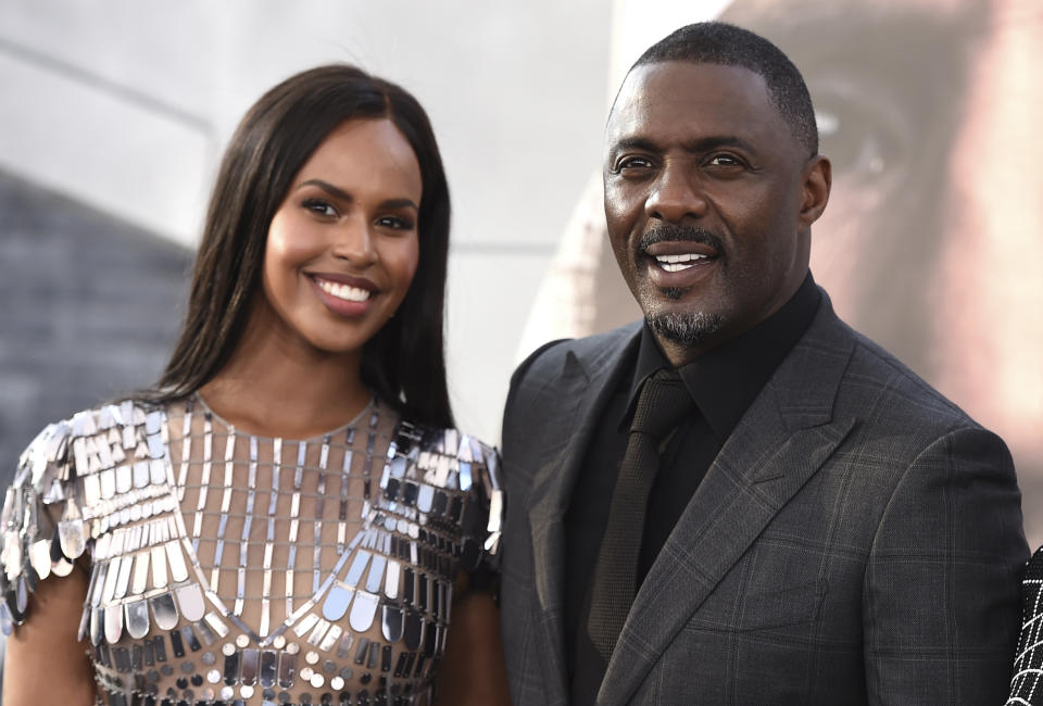 Cast member Idris Elba, right, and Sabrina Dhowre Elba arrive at the Los Angeles premiere of "Fast & Furious Presents: Hobbs & Shaw" on Saturday, July 13, 2019, at the Dolby Theatre. (Photo by Jordan Strauss/Invision/AP)