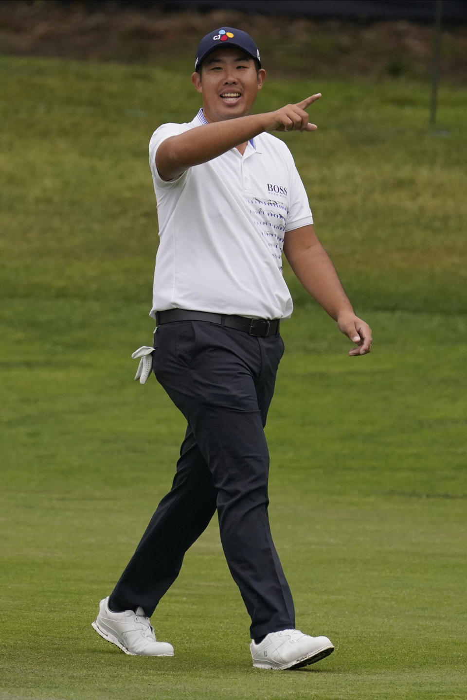 Byeong Hun An of South Korea, reacts after a hole-in-one on the 11th hole during the final round of the PGA Championship golf tournament at TPC Harding Park Sunday, Aug. 9, 2020, in San Francisco. (AP Photo/Jeff Chiu)