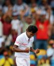 West Indies cricketer Devendra Bishoo celebrates dismissing Australian cricket team captain Michael Clarke during the third day of the first-of-three Test matches between Australia and West Indies at the Kensington Oval stadium in Bridgetown on April 9, 2012. Australia is chasing West Indies score of 449/9 from first innings. AFP PHOTO/Jewel Samad (Photo credit should read JEWEL SAMAD/AFP/Getty Images)