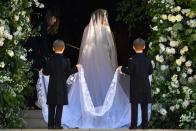 <p>To add a touch of drama to her elegant, modern Givenchy gown, the bride opted for a stunning 16.5 foot long silk tulle veil, but there was <a href="https://www.townandcountrymag.com/society/tradition/a20753874/meghan-markle-royal-wedding-veil-secret-meaning/" rel="nofollow noopener" target="_blank" data-ylk="slk:a secret hidden inside of the delicate decoration;elm:context_link;itc:0;sec:content-canvas" class="link ">a secret hidden inside of the delicate decoration</a>. The veil, by British designer Clare Waight Keller, who also designed the wedding dress, payed homage to the Commonwealth by featuring edges embroidered with flowers from all 53 of the Commonwealth countries. </p>