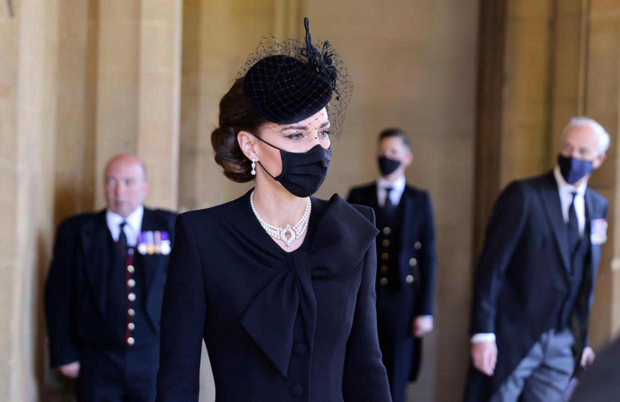 Kate, Duchess of Cambridge, center, arrives to attend the funeral of Britain's Prince Philip inside Windsor Castle in Windsor, England, Saturday, April 17, 2021.