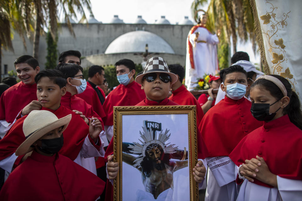 Altar servers take part in an event marking Good Friday at the Metropolitan Cathedral in Managua, Nicaragua, Friday, April 7, 2023. Holy Week commemorates the last week of the earthly life of Jesus, culminating in his crucifixion on Good Friday and his resurrection on Easter Sunday. (AP Photo/Inti Ocon)