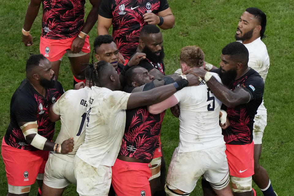 England's Ollie Chessum, 3rd right, gets involved in a scuffle with Fiji players during the Rugby World Cup quarterfinal match between England and Fiji at the Stade de Marseille in Marseille, France, Sunday, Oct. 15, 2023. (AP Photo/Lewis Joly)