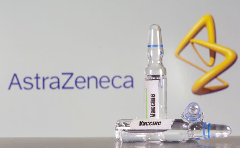 FILE PHOTO: test tube labelled with the vaccine is seen in front of AstraZeneca logo in this illustration taken