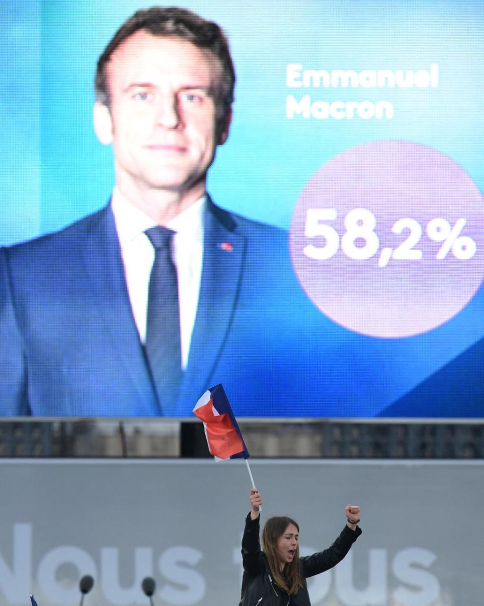 A Macron supporter reacts after the victory (AFP via Getty Images)