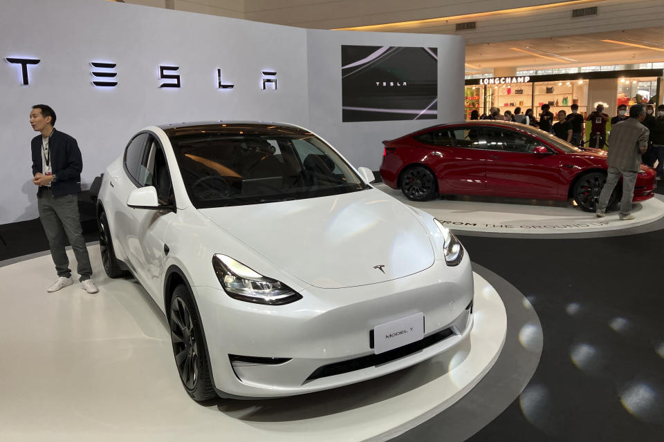 Tesla electric vehicles are displayed during a public launching event Wednesday, Dec. 7, 2022, in Bangkok, Thailand. Tesla has launched sales in Thailand, offering its popular Model 3 and Model Y at prices aimed at competing with rivals like China’s BYD. (AP Photo/Tassanee Vejpongsa)