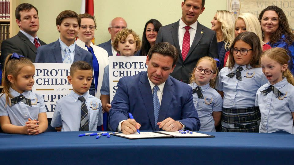 Florida Gov. Ron DeSantis signs the Parental Rights in Education bill on March 28, 2022, in Shady Hills, Florida. - Douglas R. Clifford/Tampa Bay Times/AP/File