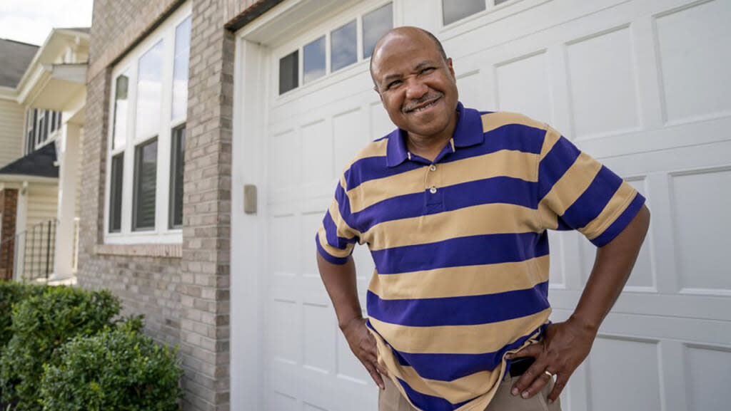 Banking executive Bob Marshall, an active stock investor, poses for a photo at his home in Ashburn, Va., Friday, Aug. 7, 2020. Nearly half of all U.S. households don’t own any stocks, and a disproportionate number of them are from Black and other racial-minority households. Differences in financial-literacy education may be one factor, Marshall said. Or, because fewer Black families have wealth that has carried through generations, they may be more wary of risky investments. (AP Photo/J. Scott Applewhite)