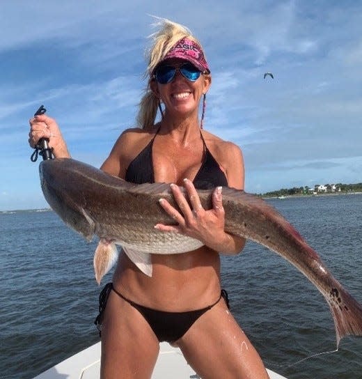 Local angler Laurie Teasley brought in this big redfish near Ponce Inlet before conditions took a bad turn this week.