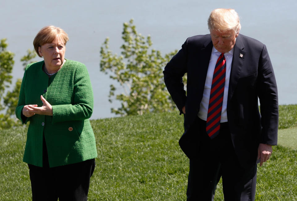 <p>Germany’s Chancellor Angela Merkel talks with President Donald Trump at a family photo session with the leaders of the G-7 summit in Charlevoix, Quebec, Canada, June 8, 2018. (Photo: Yves Herman/Reuters) </p>