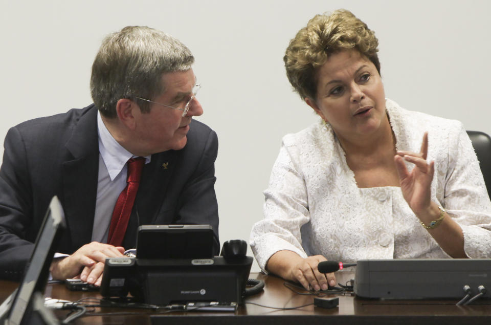 International Olympic Committee (IOC) President Thomas Bach, left, speaks with Brazil's President Dilma Rousseff during a meeting at Planalto Palace in Brasilia, Brazil, Tuesday, Jan. 21, 2014. The city of Rio de Janeiro will host the Olympics in 2016. (AP Photo/Joel Rodrigues)