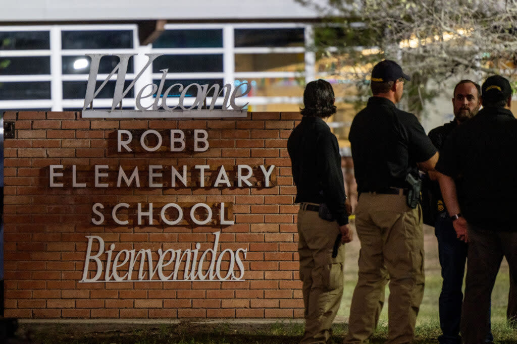 Police gather following the mass shooting at Robb Elementary School on May 24, 2022 in Uvalde, Texas.