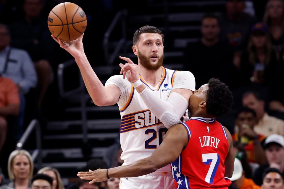 Jusuf Nurkic #20 of the Phoenix Suns passes over Kyle Lowry #7 of the Philadelphia 76ers during the first half at Footprint Center on March 20, 2024 in Phoenix.