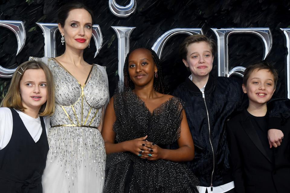 Angelina Jolie and her children Vivienne, Zahara, Shiloh, and Knox attend the European premiere of Maleficent: Mistress of Evil in 2019.