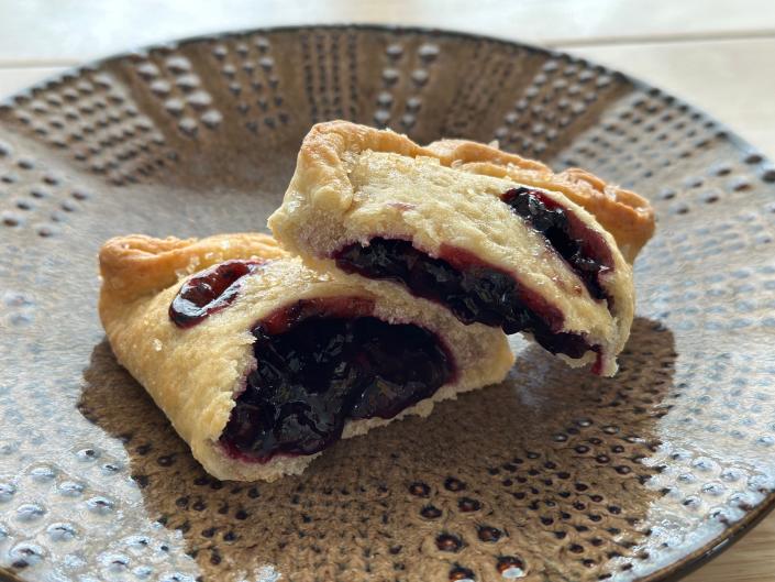 blueberry lemon pie broken in half